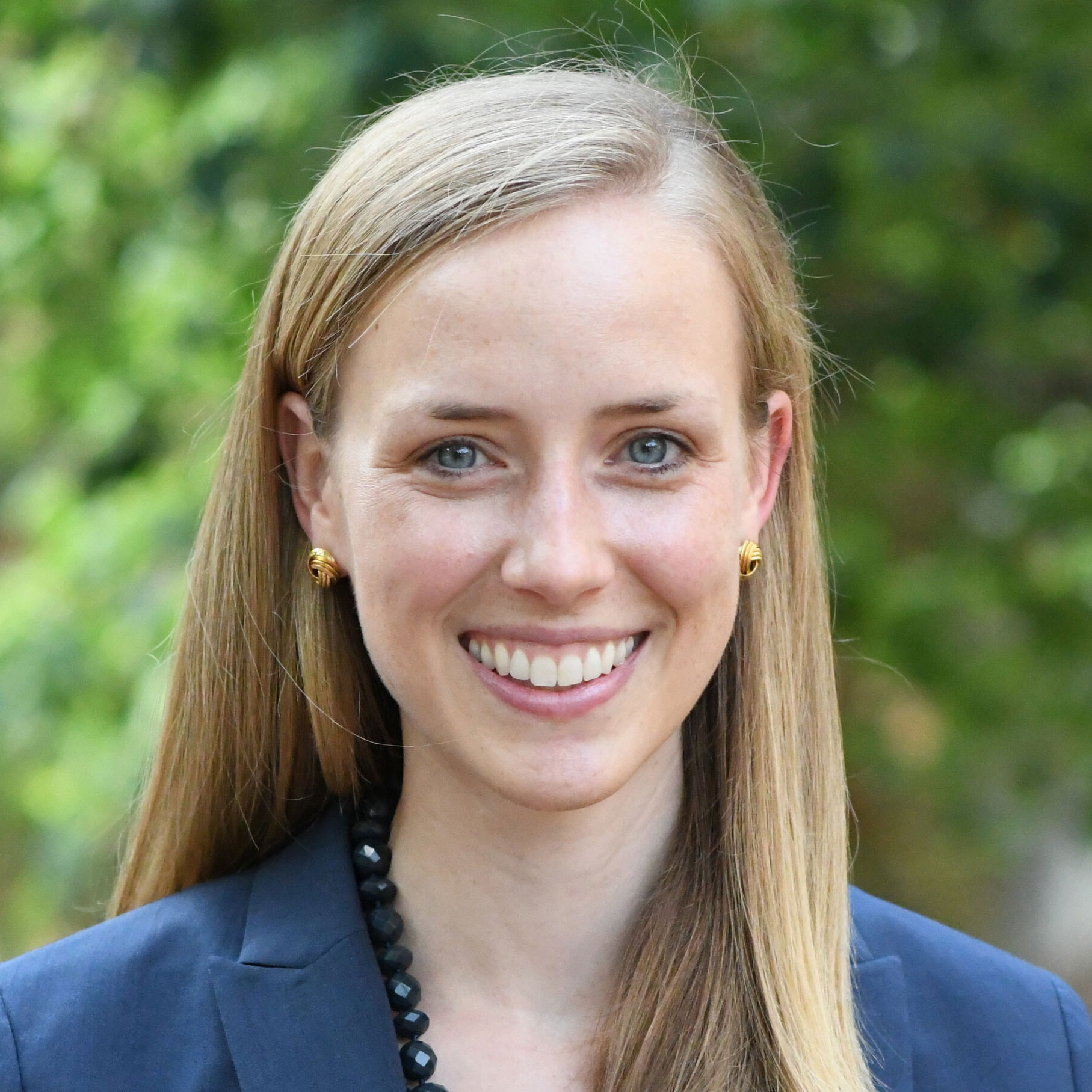 Portrait of Elizabeth Poindexter wearing a blue suit jacket