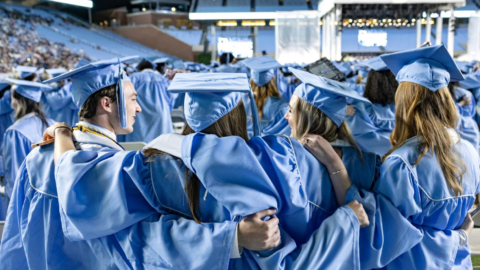 Students in graduation regalia at UNC-Chapel Hill