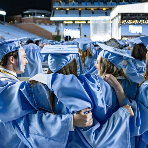 Students in graduation regalia at UNC-Chapel Hill