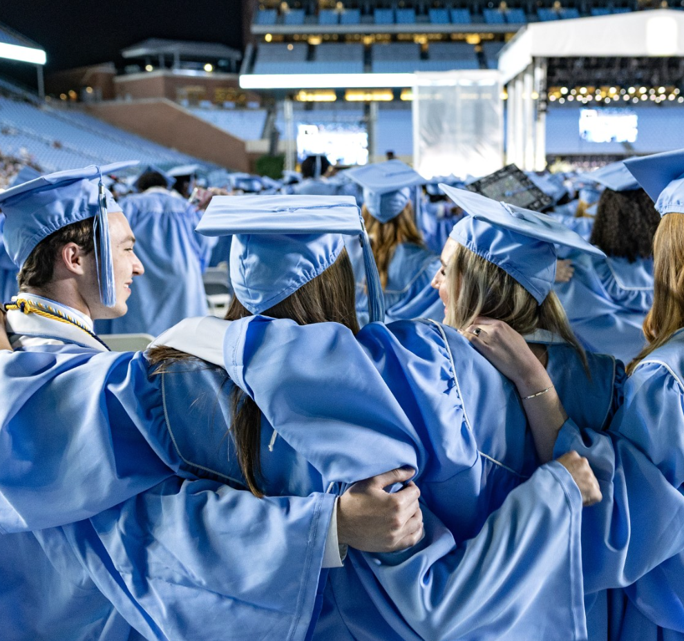 Students in graduation regalia at UNC-Chapel Hill