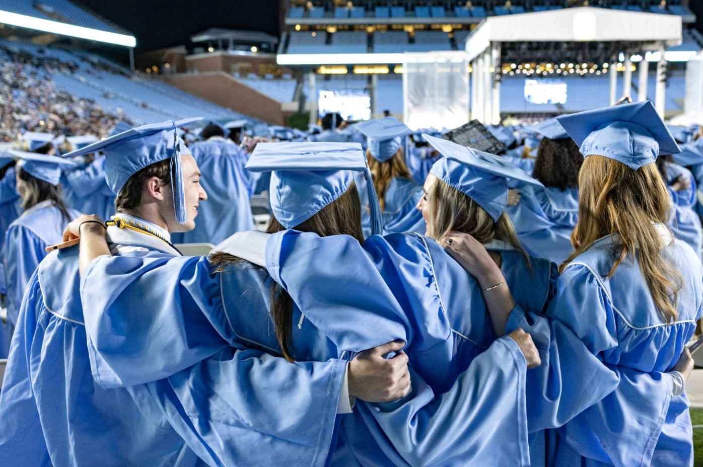 Students in graduation regalia at UNC-Chapel Hill